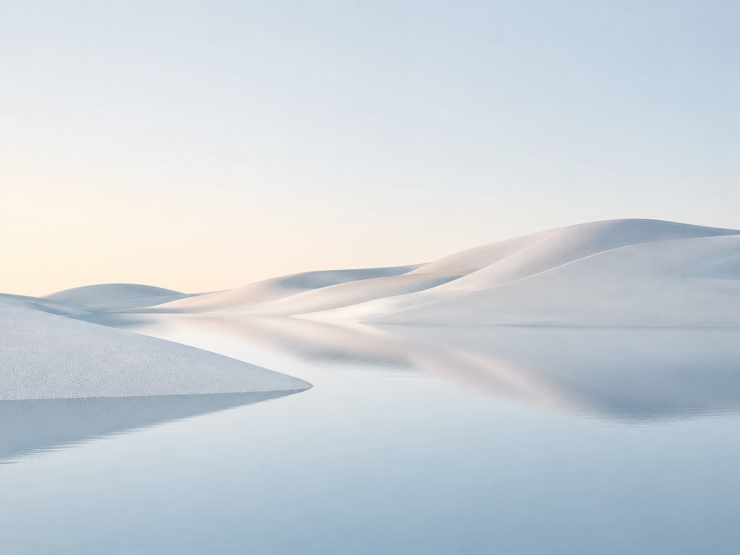 Calm dunes reflected in still water at soft daylight